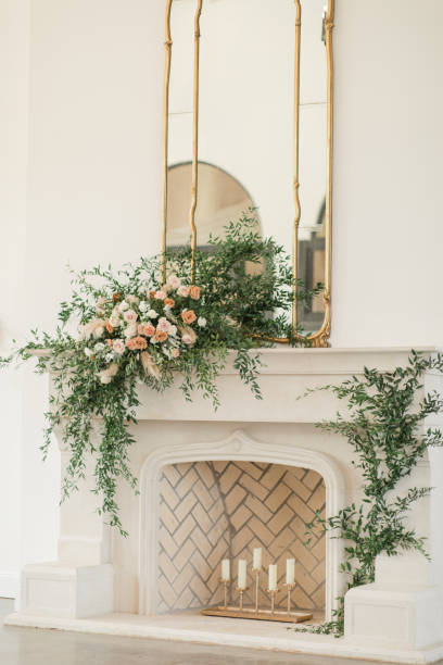 Candles in a Chic Neutral Herringbone Brick Fireplace Adorned with Greenery & Florals for a Chic Neutral, Romantic Rustic Modern Style Wedding Reception Decor at a Spring Wedding in Tennessee