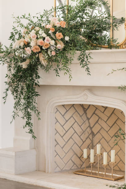 istock Candles in a Chic Neutral Herringbone Brick Fireplace Adorned with Greenery & Florals for a Chic Neutral, Romantic Rustic Modern Style Wedding Reception Decor at a Spring Wedding in Tennessee 1395649240