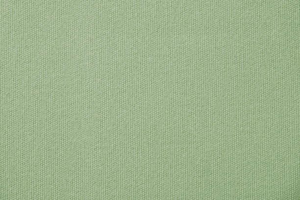 istock Green canvas cotton texture background, fashion 1395649338