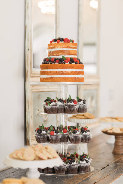 istock Fresh Berry Naked Wedding Cake on a Dessert Bar at a Chic Neutral, Romantic Rustic Modern Style Wedding Reception Decor at a Spring Wedding in Tennessee 1395649993