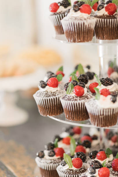 istock Fresh Berry Chocolate Cupcakes on a Dessert Bar at a Chic Neutral, Romantic Rustic Modern Style Wedding Reception Decor at a Spring Wedding in Tennessee 1395650050