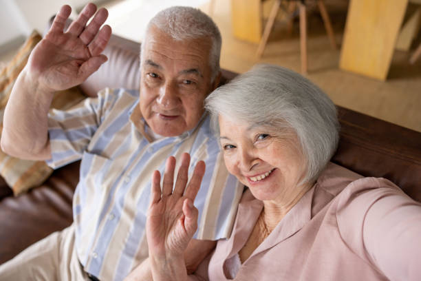 istock Senior couple greeting on a video call 1395651903
