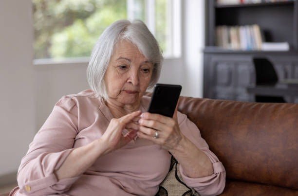 istock Senior woman using a cell phone but looking confused 1395651936