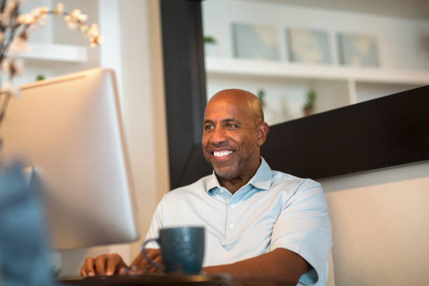 istock Mature African American man working from his home office. 1395652919