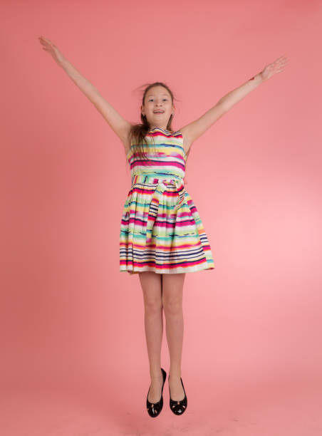 istock cheerful girl in a jump 1395653047