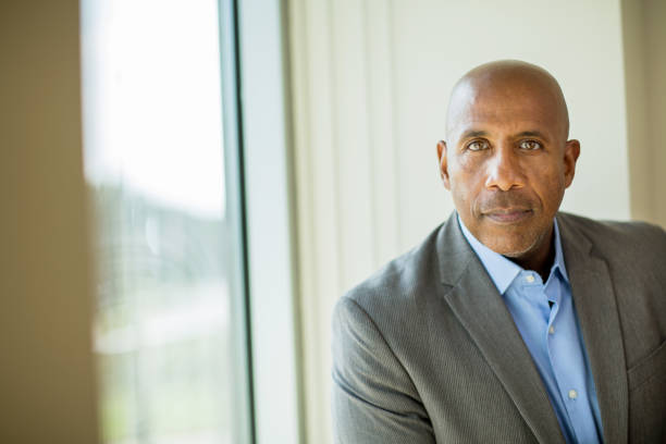 istock Happy mature African American man at work. 1395654182
