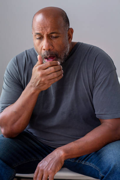 Older African American man not feeling well. stock photo