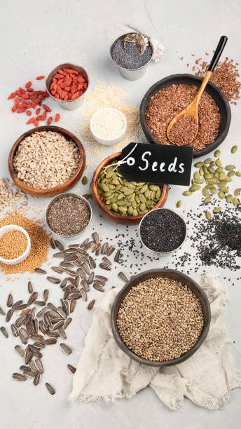 istock Variety of edible seeds on light background. 1395657675