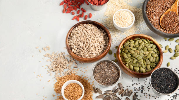 istock Variety of edible seeds on light background. 1395657677