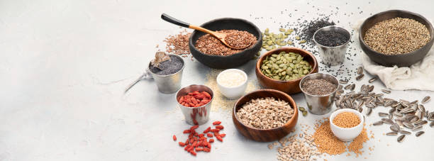 istock Variety of edible seeds on light background. 1395657929