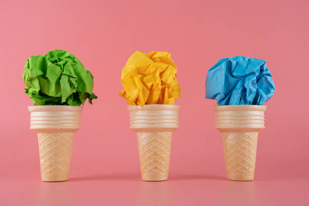 istock Green, yellow, blue paper cubes placed inside an ice cream cone 1395658794