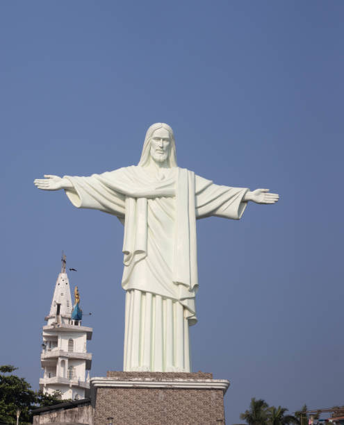 istock White color Christ statue with blue sky 1395660637