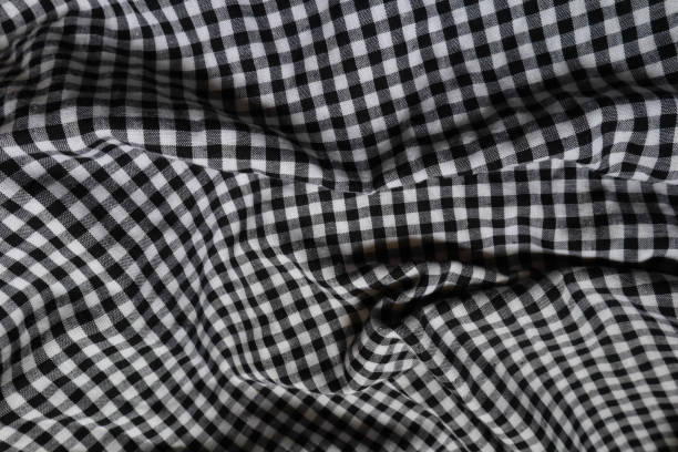 istock Background. White and black plaid fabric, suitable for background 1395663431