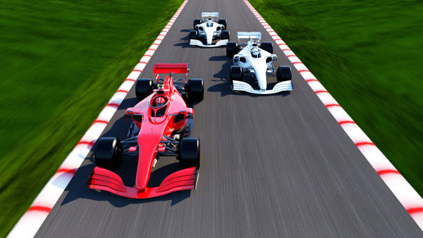 red race car leading on a race track