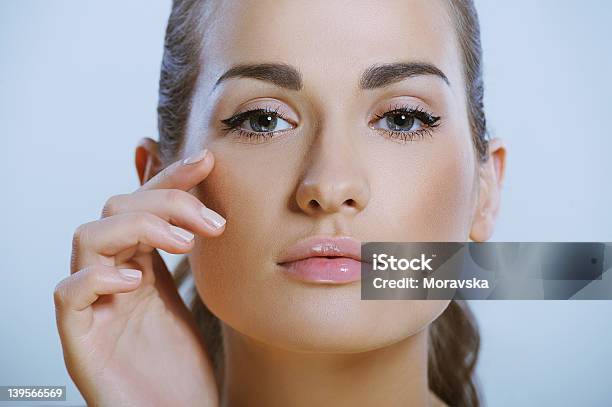 Pretty Girl Touches The Skin Around Eye Stock Photo - Download Image Now - Adult, Adults Only, Beautiful Woman