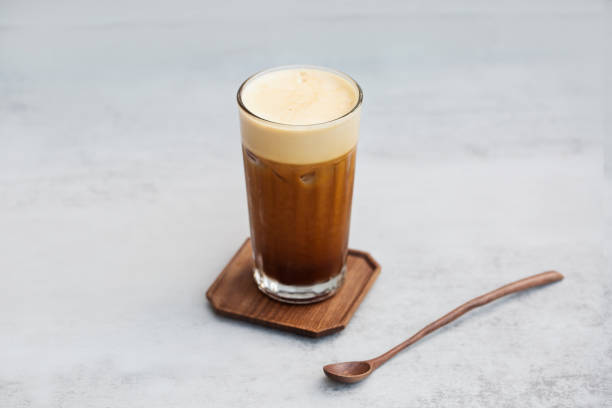 istock A cup of coffee sits on a table with a white background 1395666086