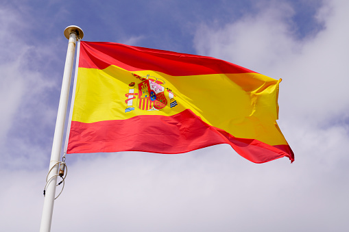 spain spanish flag float over sky in mat with wind