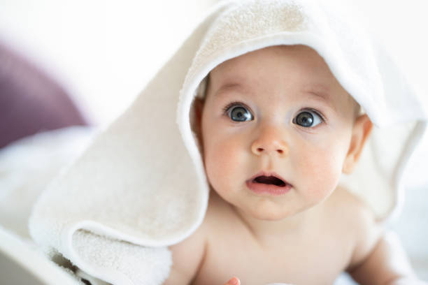 istock Baby wearing towel after bath 1395666422
