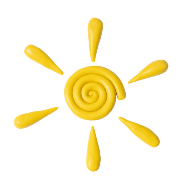 Golden sun face symbol with sunrays isolated on white. Wooden decor ornament symbol painted on gold paint. Summer weather and heat sign.