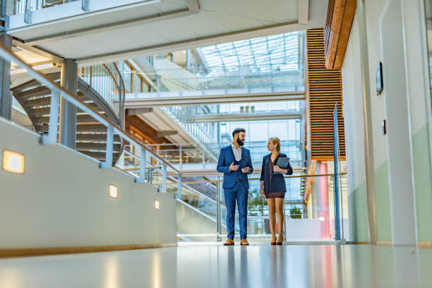 istock Business people talking in the hall 1395669666