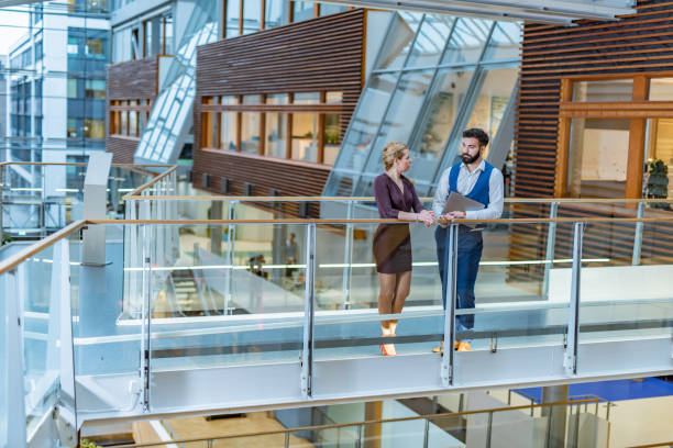 istock Coworkers in business building 1395670344