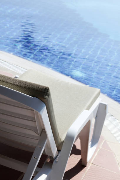 istock Lounger by the pool 1395670555