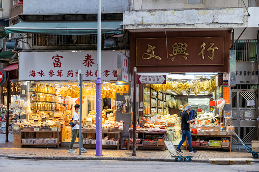 Hong Kong - April 14, 2022 : People at the Dried Seafood Street / Tonic Food Street in Sai Ying Pun, Hong Kong.