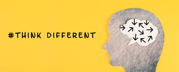 istock Think different stands on the yellow background, head with brain, being a nonconformist, standing out from the crowd, creative and visionary concept 1395678355
