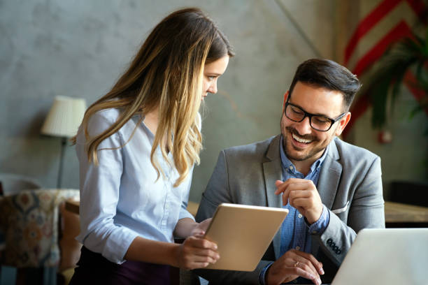 istock Business people working, having fun and chatting at workplace office 1395680776