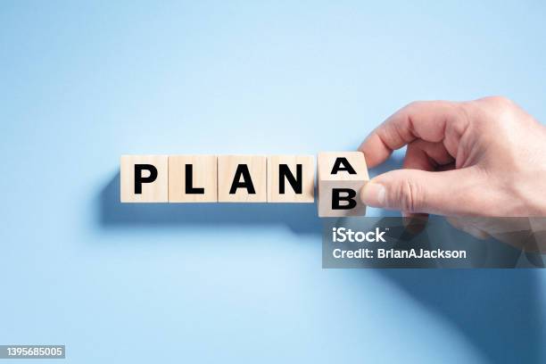 Change The Wooden Cube Block Word From Plan A To Plan B Stock Photo - Download Image Now