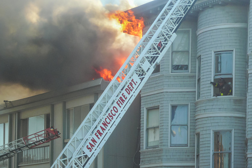 San Francisco, California, United States of America. August, 2007. San Francisco Fire Department. Firefighters putting out a house fire in the city of San Francisco.