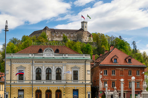 Academia Philarmonic on Congress square and Old castle on Castle hill in the historical center of Ljubljana, Slovenia