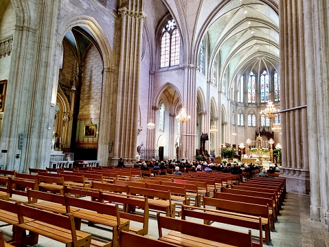 Interior view of the Montpellier Cathedral, the church is dedicated to Saint Peter and she is ocated in the center of the city. The image shows the main nave wit pews.