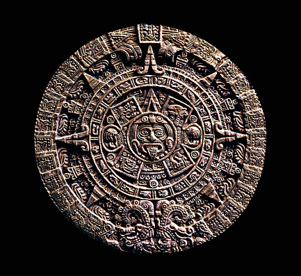 Aztec relic The Stone of the Sun against a black background
