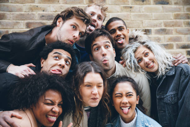 istock Friends making a selfie with funny faces 1395691051