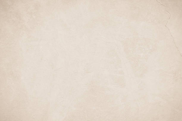 istock Old concrete wall texture background. Close up retro plain beige color cement material surface rough for show or advertise promote product content on display and brown paper design element concept. 1395692760