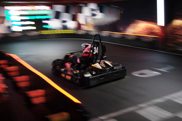 Electric Go kart driver speed rive indoor circuit race. Electric Go kart driver speed rive indoor circuit race go carting stock pictures, royalty-free photos & images