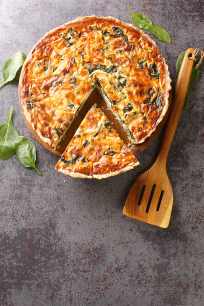 istock Spinach and herb Florentine quiche for breakfast closeup. Vertical top view 1395693705