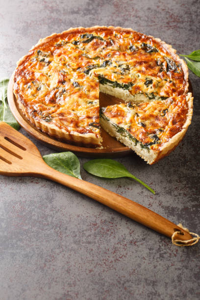 istock Spinach and herb Florentine quiche for breakfast closeup. Vertical 1395693791