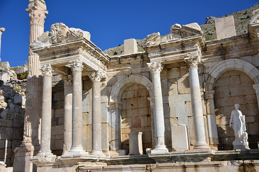 ancient greek fountain with columns on blue sky background, Sagalassos Turkey