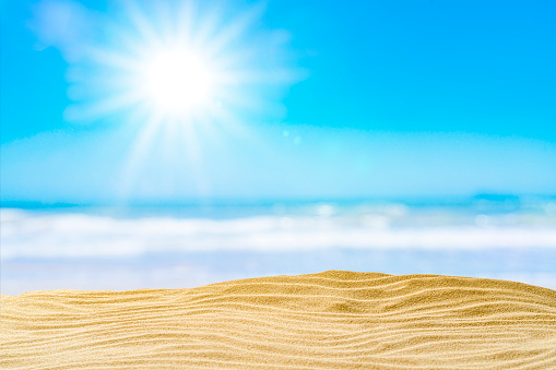 Gold colored sandy beach dune with bright sun background. High resolution 42Mp outdoors digital capture taken with SONY A7rII and Zeiss Batis 40mm F2.0 CF lens