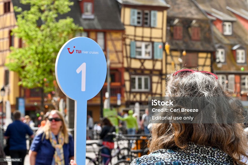 tour guide holding sign