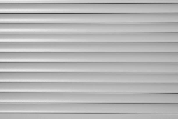 istock Roller blinds, gray horizontal metal roller shutters, close-up 1395696394