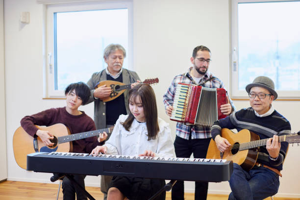 istock Adults playing musical instruments happily 1395696443