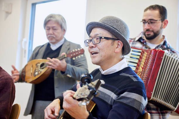 Adults playing musical instruments happily