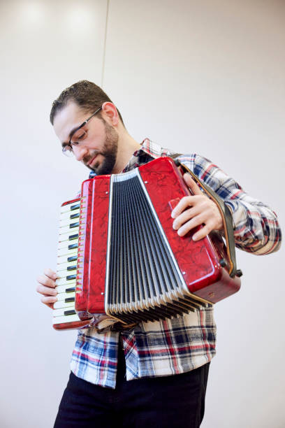 istock A man playing an accordion 1395696461