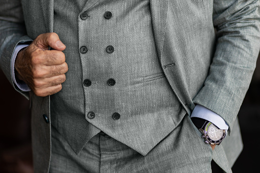 Close-up of a senior businessman in a full suit. CEO in business wear. Senior man in a three piece suit.