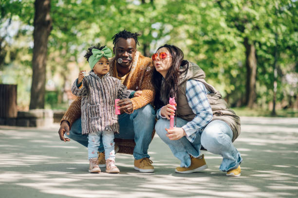 istock Multiracial family having fun in the park 1395698617
