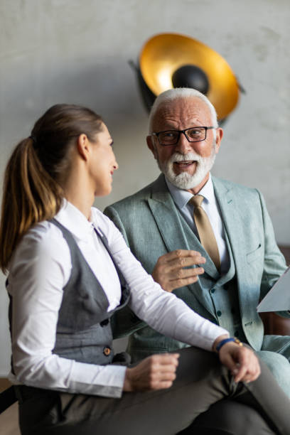 istock Senior businessman having a casual meeting with his apprentice 1395698710