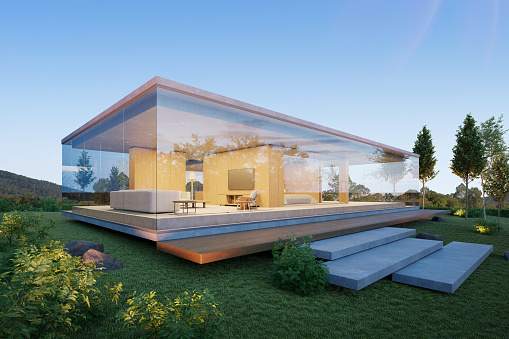 Modern backyard in the suburbs, big windows, wooden chairs and a modern picnic table, white facade of the modern building exterior, beauty of the nature and an amazing upper class residential district.